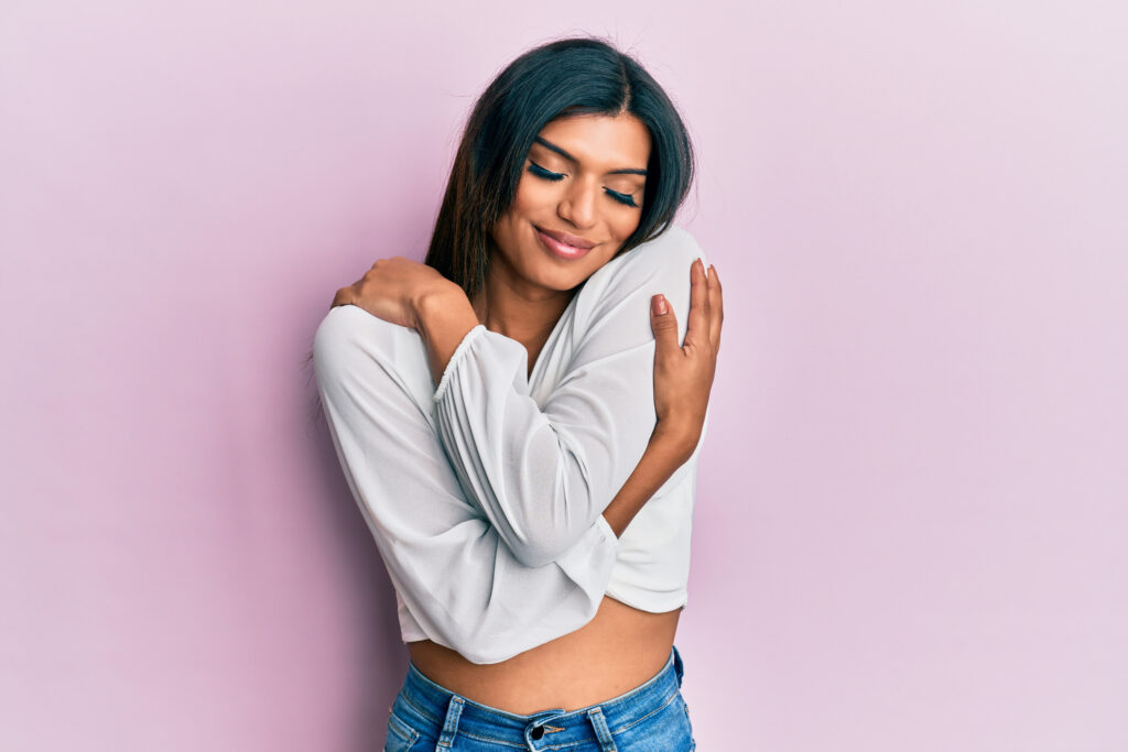 Transgender individual looking happy after laser hair removal treatment